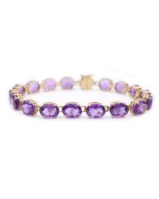 14 Karat Yellow Gold Ladies Amethyst Tennis bracelet  6 1/2 inches