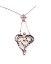 14 Karat Yellow white Gold Victorian Diamond Heart shaped pendant and .835 silver chain